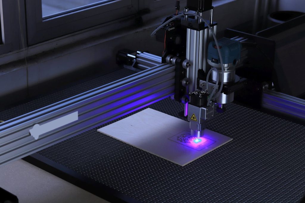 Mastering the First Impression: Your intriguing post title goes here Close-up of a CNC laser engraving machine processing a wooden piece.
