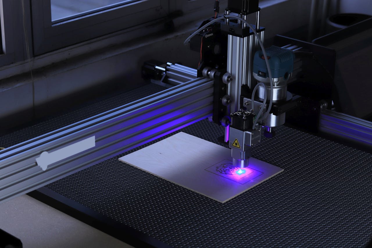 Mastering the First Impression: Your intriguing post title goes here Close-up of a CNC laser engraving machine processing a wooden piece.